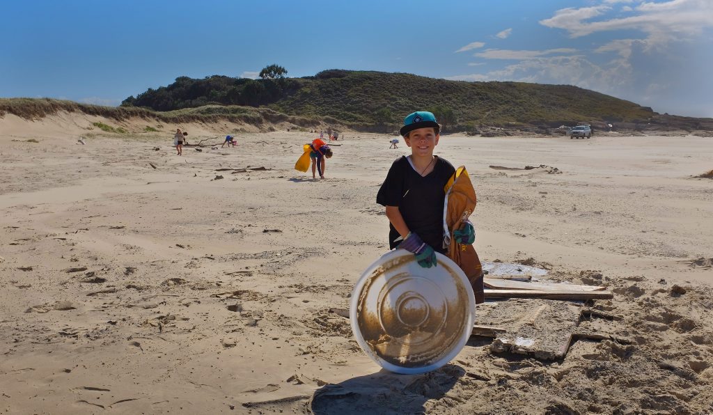 Evan's Head resident Jordie Forsyth 9, was one of the many younger clean up volunteers, is pictured with the largest piece of plastic he found during the clean up. Evan's Head resident Jordie Forsyth 9, was one of the many younger clean up volunteers, is pictured with the largest piece of plastic he found during the clean up.